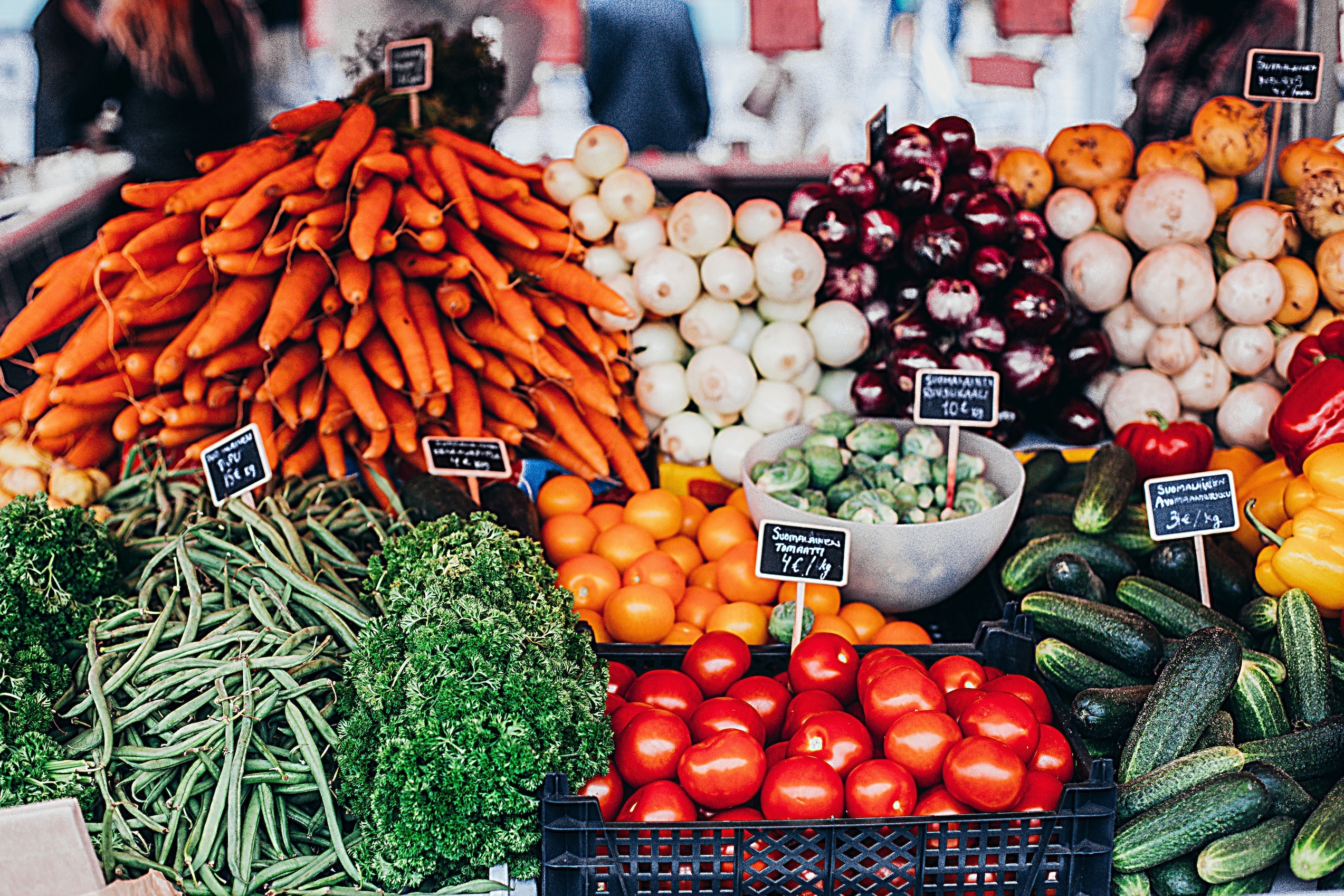 An array of fresh vegetables for sale at a market.