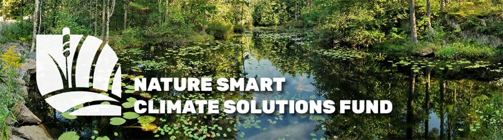 The words "Nature smart climate solutions fund" over a river surrounded by greenery.