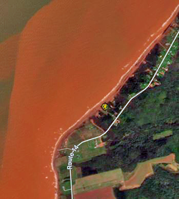A satellite map of a PEI coastline with a road parallel to the coast.