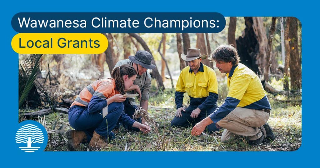 An image of four individuals - three men and one woman - in a forest knelt down observing what appears to be a plant in the ground. To the top left of the image is the text 'Wawanesa Climate Champions: Local Grants' and to the bottom left of the image is a circular logo graphic which resembles a tree. 