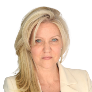 Le français suit.<br />
A picture of a person with long blonde hair wearing a beige suit smiling at the camera, framed by a yellow circle.<br />
Photo d'une personne aux longs cheveux blonds portant un costume beige et souriant à l'appareil photo, encadrée d'un cercle jaune.</p>
<p>